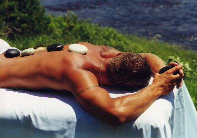 Picture of the Hot Stone Massage being done on a male client
